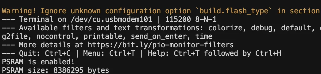 PlatformIO's serial monitor in the VS Code terminal, showing the port and speed on its first lines and then the sketch printing that PSRAM is enabled at 8386295 bytes.