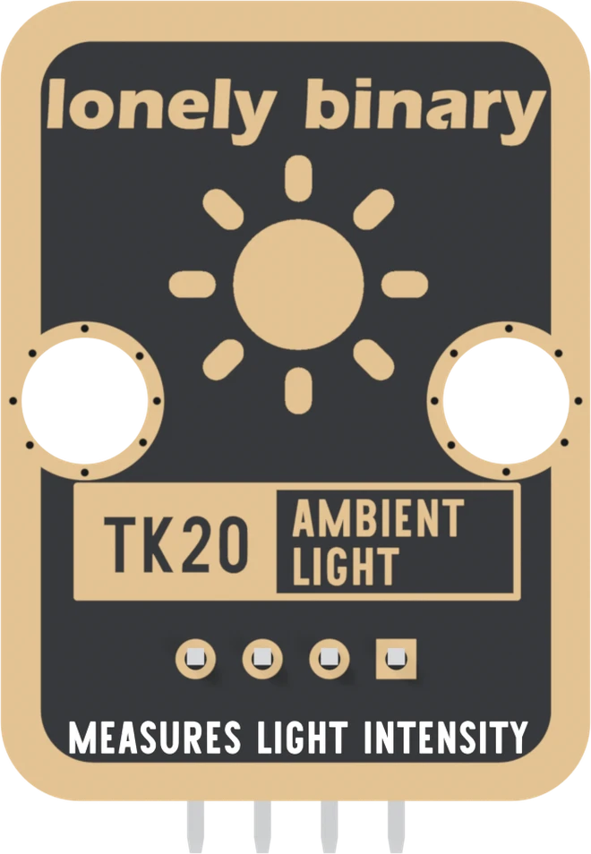 The back of the TK20: a black board with a gold border, lonely binary across the top, a large gold sun, two mounting holes, TK20 AMBIENT LIGHT in a boxed label, four header pads in a row with the square one on the right, and MEASURES LIGHT INTENSITY along the bottom.