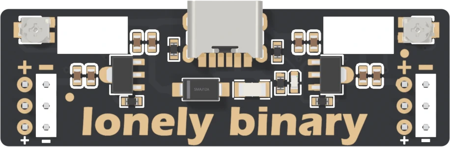 The step-down adapter from directly above, USB-C socket at the top: at each end, a plus sign over a column of three round gold pads and a minus sign over a white block of three more, with plus on the left of minus at both the left and the right end. Two small square trimmers sit in the top corners.