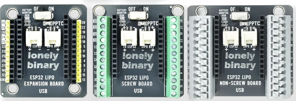The three shields side by side. Each has an OFF/ON slide switch at the top, BATTERY MONITOR IO36 and PPTC printed beside it, two white battery sockets marked TO ESP32 and LIPO BTT in the middle, lonely binary in large letters, and USB printed at the bottom. The left one has yellow male pins and black female sockets down each side, the middle one green screw terminals, the right one grey spring terminals.