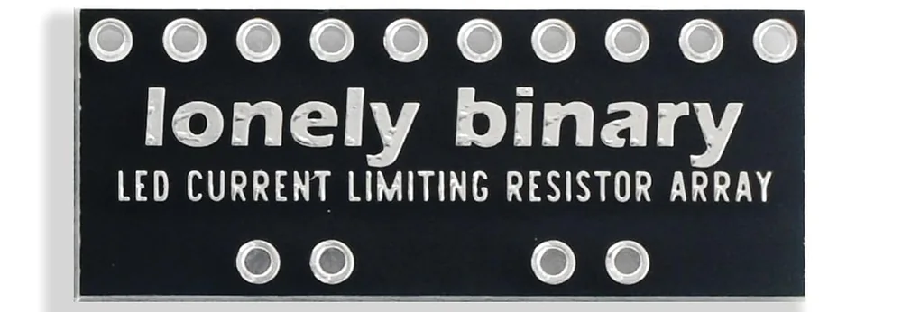 The back of the same board, plain black with the words lonely binary above LED CURRENT LIMITING RESISTOR ARRAY in white, ten plated holes along the top edge and four along the bottom.