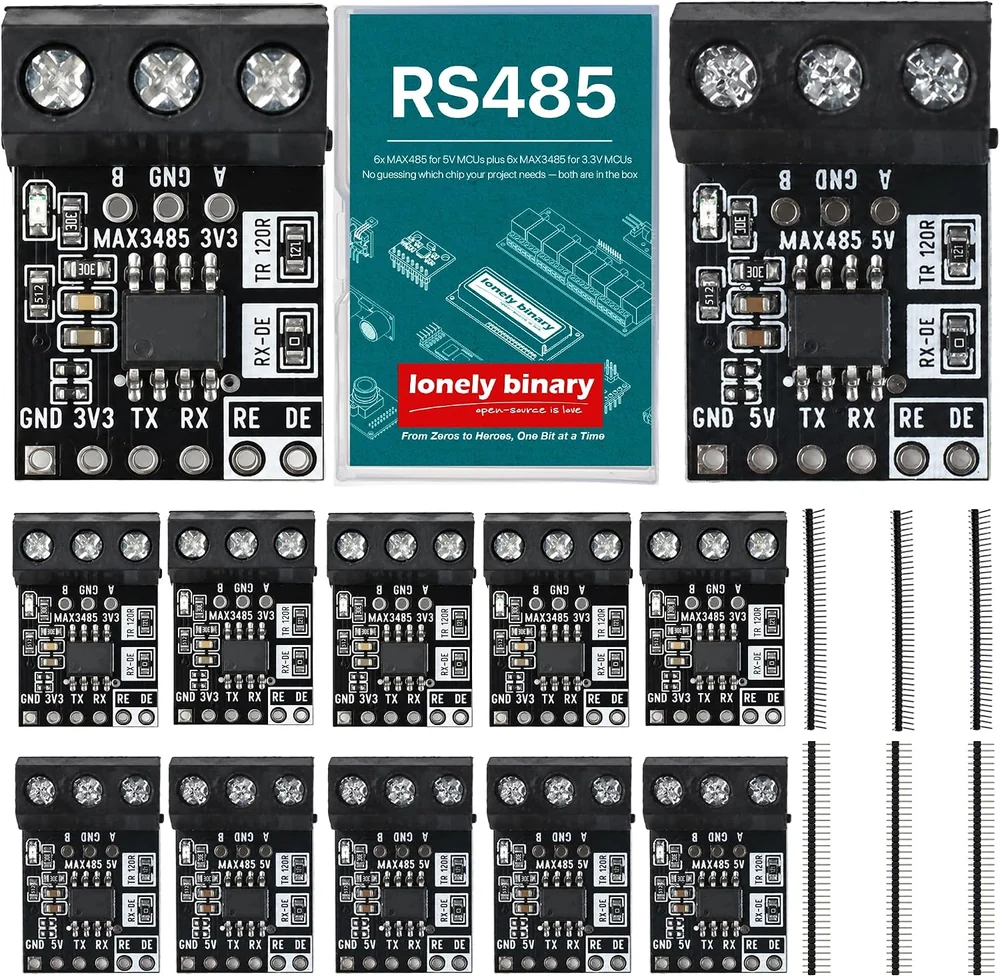The box contents laid out: a clear case printed RS485 between a large MAX3485 3V3 board and a large MAX485 5V board, a row of five more 3V3 boards, a row of five more 5V boards, and loose black pin header strips down the right-hand side.