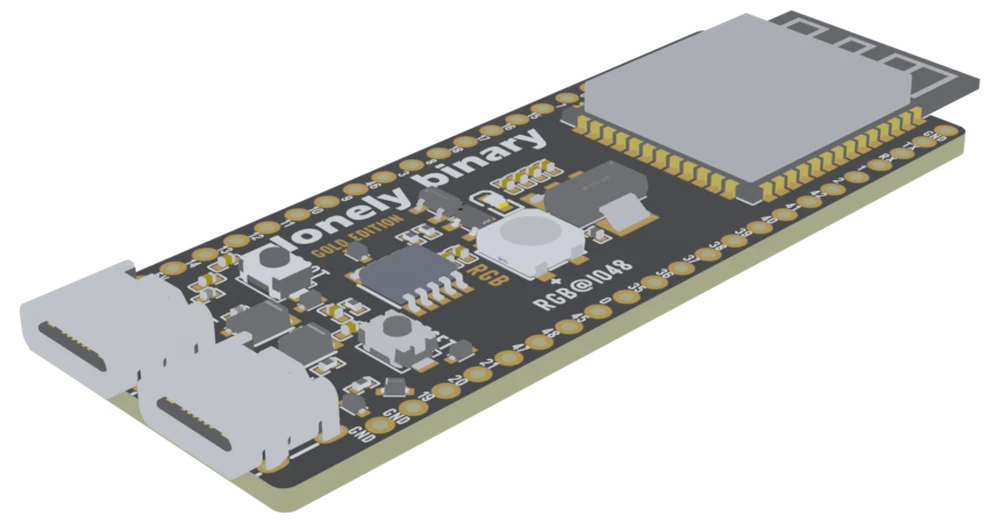The ESP32-S3 Gold Edition seen from above at an angle: a black board with gold-plated pads down both long edges, the ESP32-S3-WROOM-1 module and its PCB antenna at the far end, and two USB-C sockets side by side at the near corner.